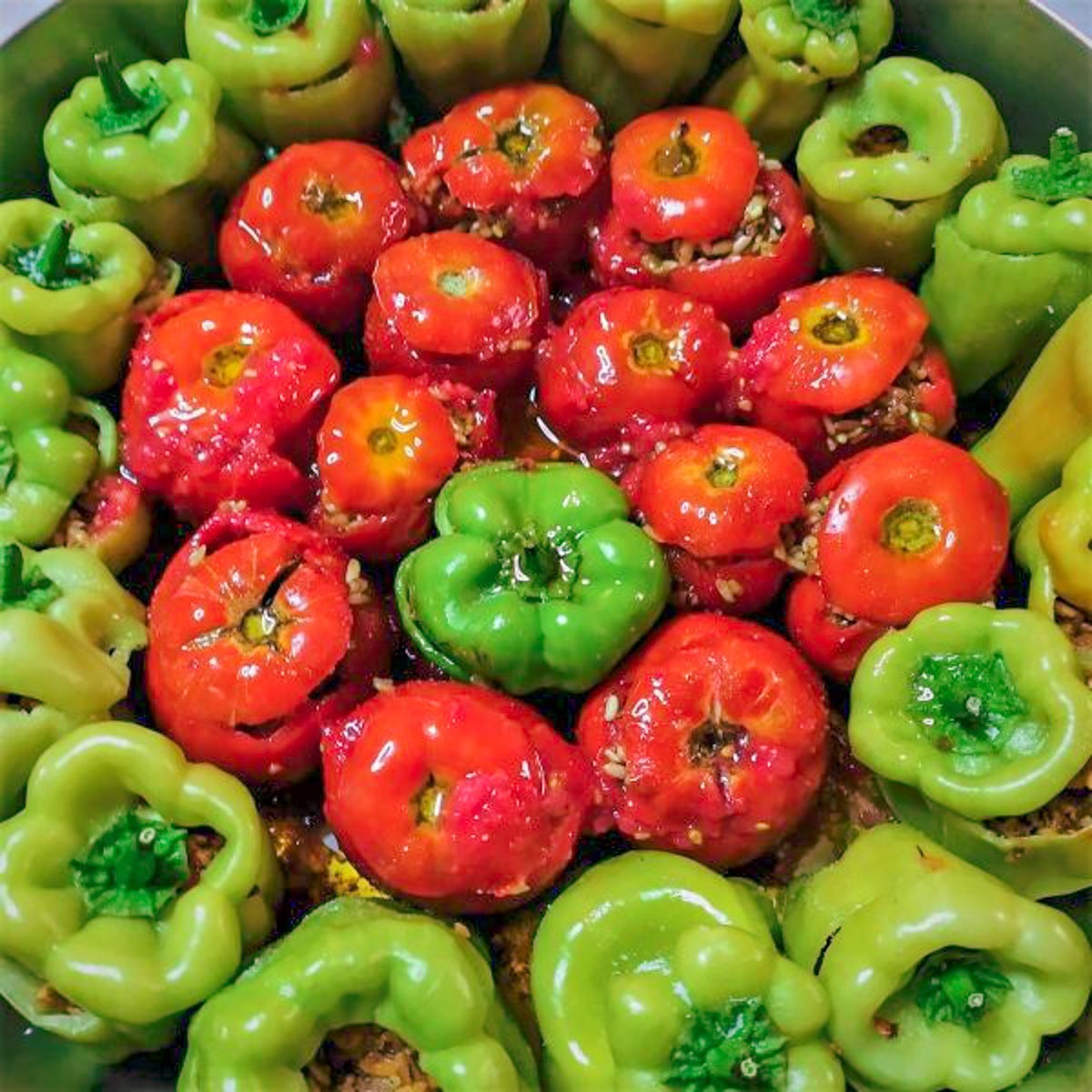 Gemista before they are cooked - Greek stuffed tomatoes and peppers